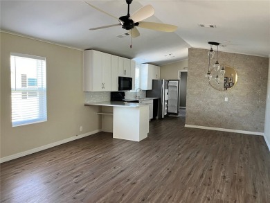 Enjoy the perfect blend of style & comfort in this partially on Mangrove Bay Golf Course in Florida - for sale on GolfHomes.com, golf home, golf lot