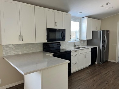 Enjoy the perfect blend of style & comfort in this partially on Mangrove Bay Golf Course in Florida - for sale on GolfHomes.com, golf home, golf lot