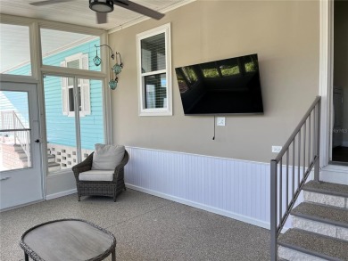 Enjoy the perfect blend of style & comfort in this partially on Mangrove Bay Golf Course in Florida - for sale on GolfHomes.com, golf home, golf lot