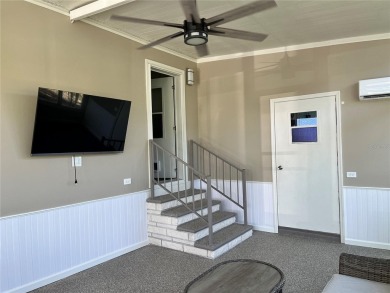 Enjoy the perfect blend of style & comfort in this partially on Mangrove Bay Golf Course in Florida - for sale on GolfHomes.com, golf home, golf lot