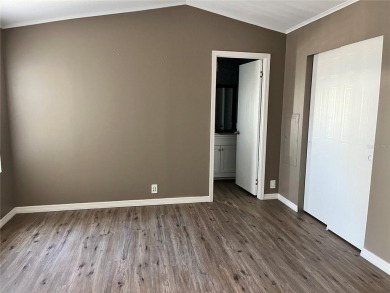 Enjoy the perfect blend of style & comfort in this partially on Mangrove Bay Golf Course in Florida - for sale on GolfHomes.com, golf home, golf lot