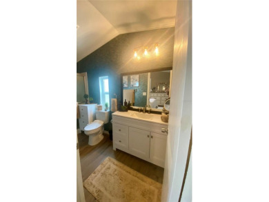 Enjoy the perfect blend of style & comfort in this partially on Mangrove Bay Golf Course in Florida - for sale on GolfHomes.com, golf home, golf lot