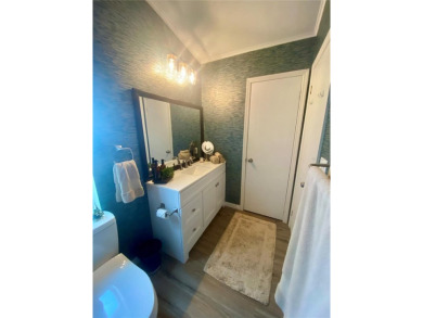 Enjoy the perfect blend of style & comfort in this partially on Mangrove Bay Golf Course in Florida - for sale on GolfHomes.com, golf home, golf lot