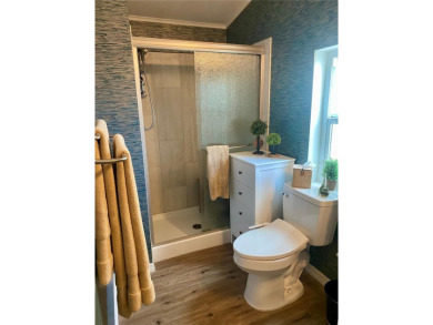 Enjoy the perfect blend of style & comfort in this partially on Mangrove Bay Golf Course in Florida - for sale on GolfHomes.com, golf home, golf lot