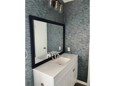 Enjoy the perfect blend of style & comfort in this partially on Mangrove Bay Golf Course in Florida - for sale on GolfHomes.com, golf home, golf lot