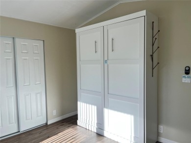 Enjoy the perfect blend of style & comfort in this partially on Mangrove Bay Golf Course in Florida - for sale on GolfHomes.com, golf home, golf lot