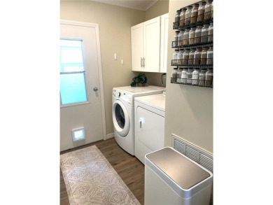 Enjoy the perfect blend of style & comfort in this partially on Mangrove Bay Golf Course in Florida - for sale on GolfHomes.com, golf home, golf lot
