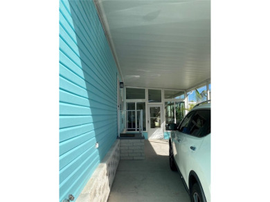 Enjoy the perfect blend of style & comfort in this partially on Mangrove Bay Golf Course in Florida - for sale on GolfHomes.com, golf home, golf lot
