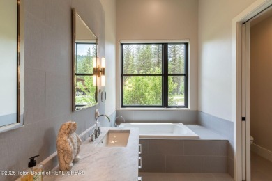 Nestled against the Bridger-Teton National Forest, 15415 Tall on Snake River Sporting Club in Wyoming - for sale on GolfHomes.com, golf home, golf lot