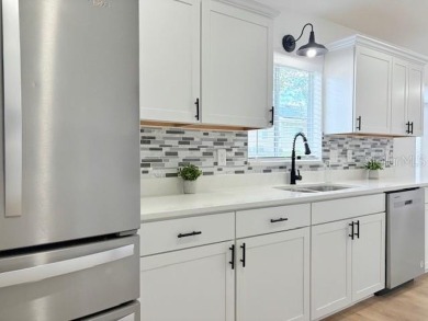COME AND SEE THIS GORGEOUS REMODELED HOME!  THIS IS LIKE A NEW on Eagle Ridge At Spruce Creek Country Club in Florida - for sale on GolfHomes.com, golf home, golf lot