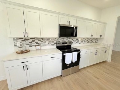 COME AND SEE THIS GORGEOUS REMODELED HOME!  THIS IS LIKE A NEW on Eagle Ridge At Spruce Creek Country Club in Florida - for sale on GolfHomes.com, golf home, golf lot