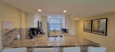 Welcome to this updated spacious condo located on the top floor on Pine Island Ridge Country Club in Florida - for sale on GolfHomes.com, golf home, golf lot