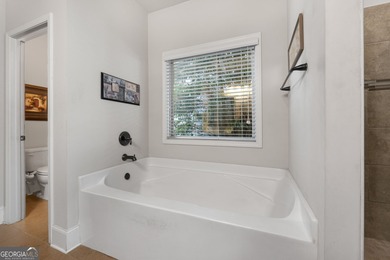 This charming 3-bedroom, 2-bath home is nestled in the sought on Canongate At Heron Bay in Georgia - for sale on GolfHomes.com, golf home, golf lot