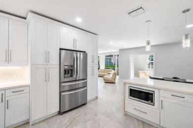 Experience luxury living in this fully renovated first-floor on Polo Club of Boca Raton in Florida - for sale on GolfHomes.com, golf home, golf lot