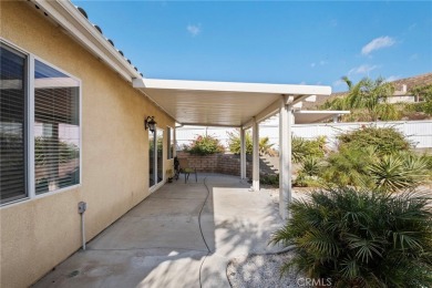 This beautiful single story home is in gate guarded 55+ on Menifee Lakes Country Club - Lakes in California - for sale on GolfHomes.com, golf home, golf lot