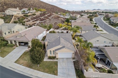 This beautiful single story home is in gate guarded 55+ on Menifee Lakes Country Club - Lakes in California - for sale on GolfHomes.com, golf home, golf lot