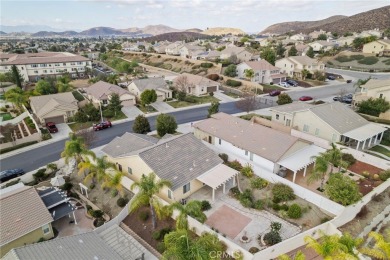 This beautiful single story home is in gate guarded 55+ on Menifee Lakes Country Club - Lakes in California - for sale on GolfHomes.com, golf home, golf lot