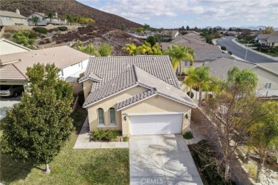 This beautiful single story home is in gate guarded 55+ on Menifee Lakes Country Club - Lakes in California - for sale on GolfHomes.com, golf home, golf lot