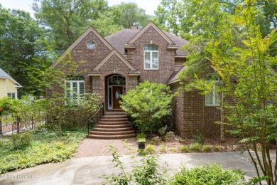 Welcome to this stately brick home overlooking the 11th hole of on Sea Trail Golf Resort in North Carolina - for sale on GolfHomes.com, golf home, golf lot