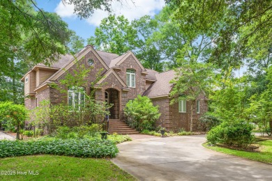 Welcome to this stately brick home overlooking the 11th hole of on Sea Trail Golf Resort in North Carolina - for sale on GolfHomes.com, golf home, golf lot