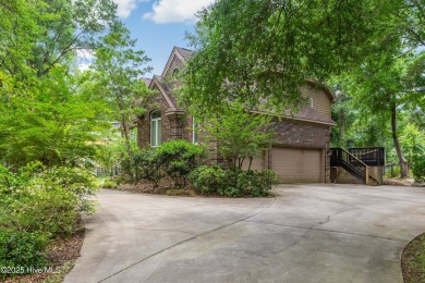 Welcome to this stately brick home overlooking the 11th hole of on Sea Trail Golf Resort in North Carolina - for sale on GolfHomes.com, golf home, golf lot