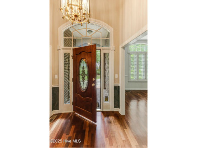Welcome to this stately brick home overlooking the 11th hole of on Sea Trail Golf Resort in North Carolina - for sale on GolfHomes.com, golf home, golf lot