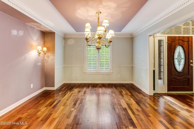 Welcome to this stately brick home overlooking the 11th hole of on Sea Trail Golf Resort in North Carolina - for sale on GolfHomes.com, golf home, golf lot