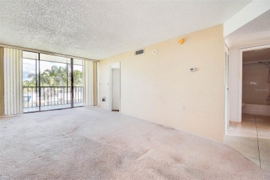 Step into a bright, easy-living 2-bedroom, 2-bath condominium on Cove Cay Country Club in Florida - for sale on GolfHomes.com, golf home, golf lot