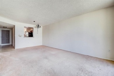 Step into a bright, easy-living 2-bedroom, 2-bath condominium on Cove Cay Country Club in Florida - for sale on GolfHomes.com, golf home, golf lot