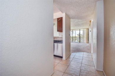 Step into a bright, easy-living 2-bedroom, 2-bath condominium on Cove Cay Country Club in Florida - for sale on GolfHomes.com, golf home, golf lot