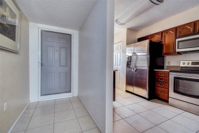 Step into a bright, easy-living 2-bedroom, 2-bath condominium on Cove Cay Country Club in Florida - for sale on GolfHomes.com, golf home, golf lot