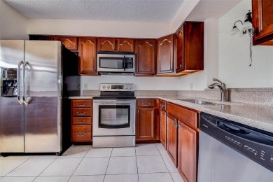 Step into a bright, easy-living 2-bedroom, 2-bath condominium on Cove Cay Country Club in Florida - for sale on GolfHomes.com, golf home, golf lot