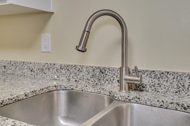 Welcome home to this beautiful four bed, two bath full brick on Augusta National Golf Course and Club in Georgia - for sale on GolfHomes.com, golf home, golf lot