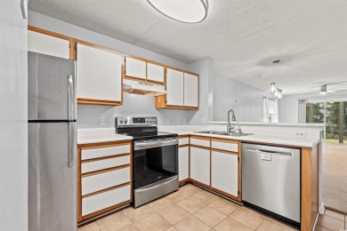 This great first floor unit, with a large screened in back porch on  in South Carolina - for sale on GolfHomes.com, golf home, golf lot