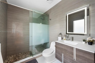 Live in the coveted, gated community of Normandy Shores, known on Normandy Shores Golf Course in Florida - for sale on GolfHomes.com, golf home, golf lot