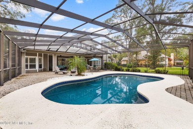 This elegant southern-style pool home in  prestigious Queens on Queens Harbour Yacht and Country Club in Florida - for sale on GolfHomes.com, golf home, golf lot