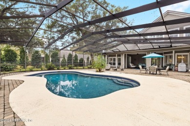 This elegant southern-style pool home in  prestigious Queens on Queens Harbour Yacht and Country Club in Florida - for sale on GolfHomes.com, golf home, golf lot