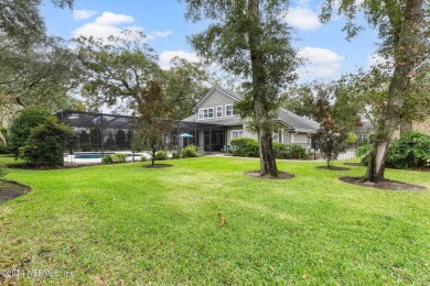 This elegant southern-style pool home in  prestigious Queens on Queens Harbour Yacht and Country Club in Florida - for sale on GolfHomes.com, golf home, golf lot