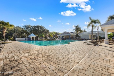 This elegant southern-style pool home in  prestigious Queens on Queens Harbour Yacht and Country Club in Florida - for sale on GolfHomes.com, golf home, golf lot