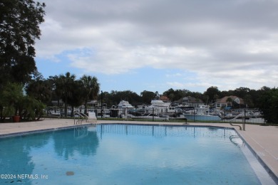 This elegant southern-style pool home in  prestigious Queens on Queens Harbour Yacht and Country Club in Florida - for sale on GolfHomes.com, golf home, golf lot