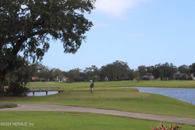 This elegant southern-style pool home in  prestigious Queens on Queens Harbour Yacht and Country Club in Florida - for sale on GolfHomes.com, golf home, golf lot