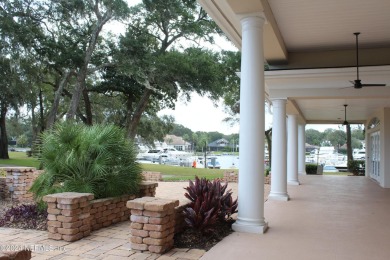 This elegant southern-style pool home in  prestigious Queens on Queens Harbour Yacht and Country Club in Florida - for sale on GolfHomes.com, golf home, golf lot