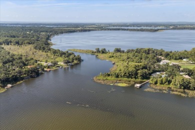 A RARE LUXURY LAKEFRONT OPPORTUNITY Welcome to a lifestyle on Deer Island Country Club in Florida - for sale on GolfHomes.com, golf home, golf lot