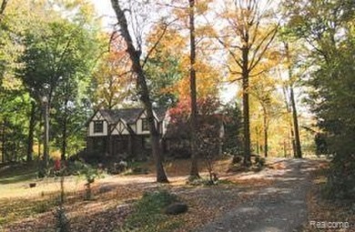 Welcome to this charming English Tudor home, nestled in tranquil on River Bank Golf Course in Michigan - for sale on GolfHomes.com, golf home, golf lot