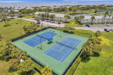 Once you pull through the gate you will not want to leave this on St. Petersburg Country Club in Florida - for sale on GolfHomes.com, golf home, golf lot