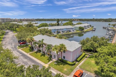 Once you pull through the gate you will not want to leave this on St. Petersburg Country Club in Florida - for sale on GolfHomes.com, golf home, golf lot