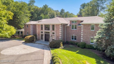 Exquisite brick estate on quiet 4+ acres. This 5+ bedrooms, 3 on Tamarack Country Club in Connecticut - for sale on GolfHomes.com, golf home, golf lot