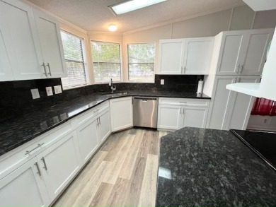 This beautifully updated 2bd, 2ba home is situated on a private on Del Tura Golf and Country Club in Florida - for sale on GolfHomes.com, golf home, golf lot