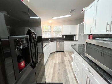 This beautifully updated 2bd, 2ba home is situated on a private on Del Tura Golf and Country Club in Florida - for sale on GolfHomes.com, golf home, golf lot