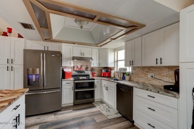 Step inside this beautifully updated 3-bedroom, 2-bath, 2-car on The Club At Pelican Bay - North Course in Florida - for sale on GolfHomes.com, golf home, golf lot